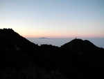 This time of year, it is common for a marine layer (i.e. clouds) to roll in at night. It sits on top of the inversion layer covering the Los Angeles basin and surrounding valleys.