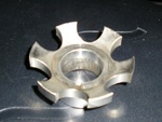 This is the center of the pulley, where it fits around the crankshaft. It has six arms, each roughly 16 millimeters (0.625 inches) long by 1.5 millimeters (0.06 inches) wide at the point where the business end sheared off. It appears to be the thinnest, weakest part of the pulley, by far - a little bit less than one quarter of a square inch of area in total. The aluminum everywhere else on the pulley appears to be many times thicker.
